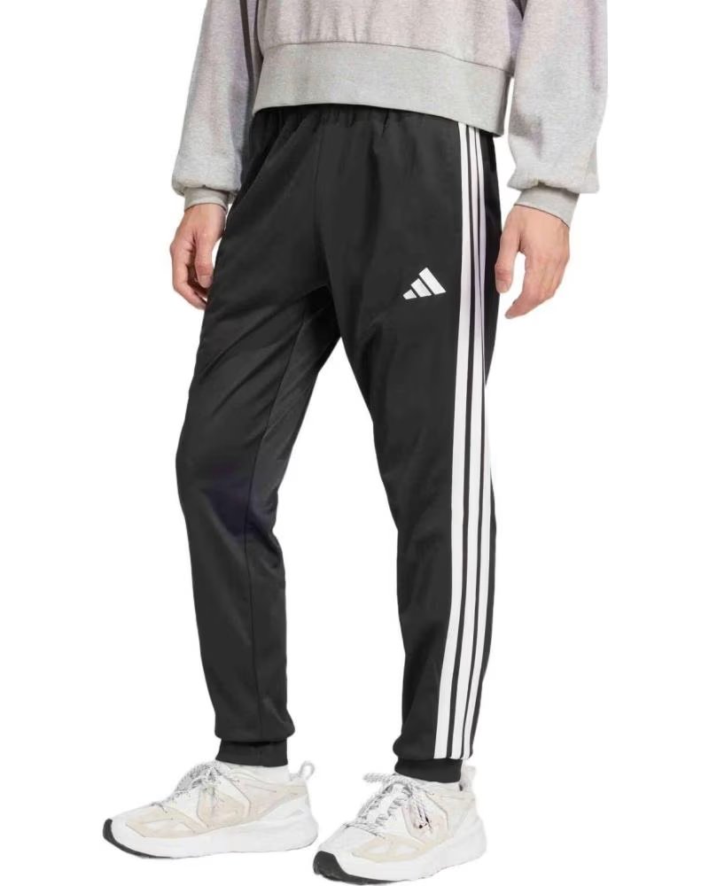 ADIDAS PANTALONI LUNGHI ADIDAS ESSENTIALS 3 STRISCE DA UOMO NEGRO