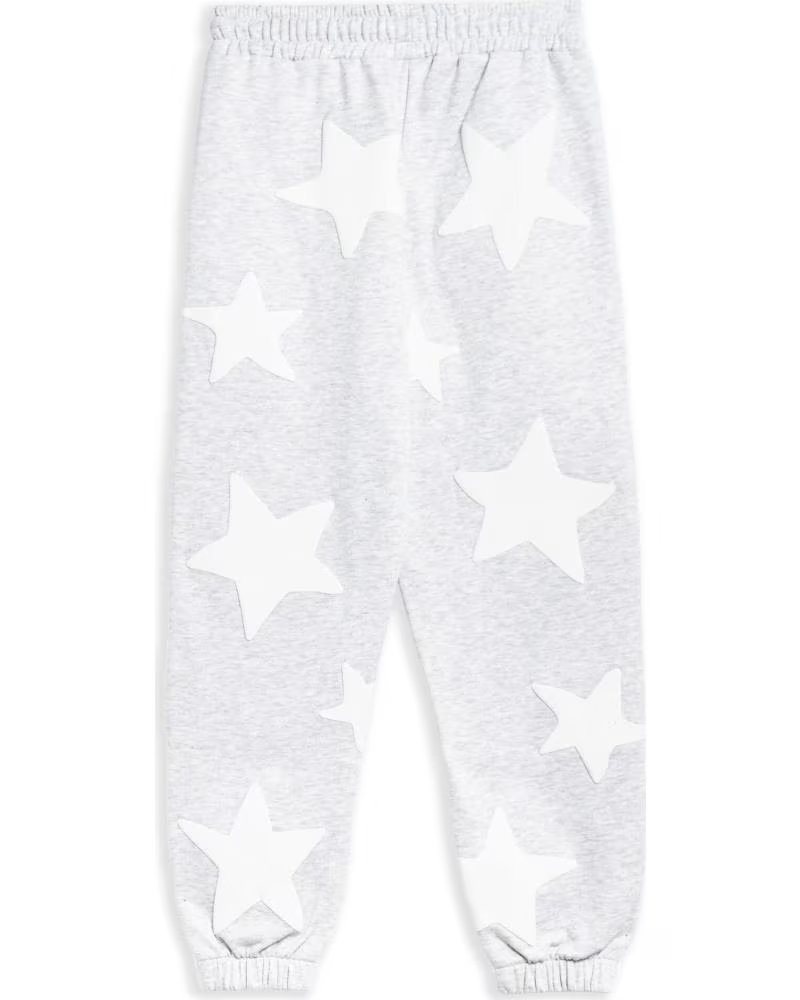 OVER STREET PANTALÓN JOGGER FALLING STARS - REF: 1179729/1180129 GRIS
