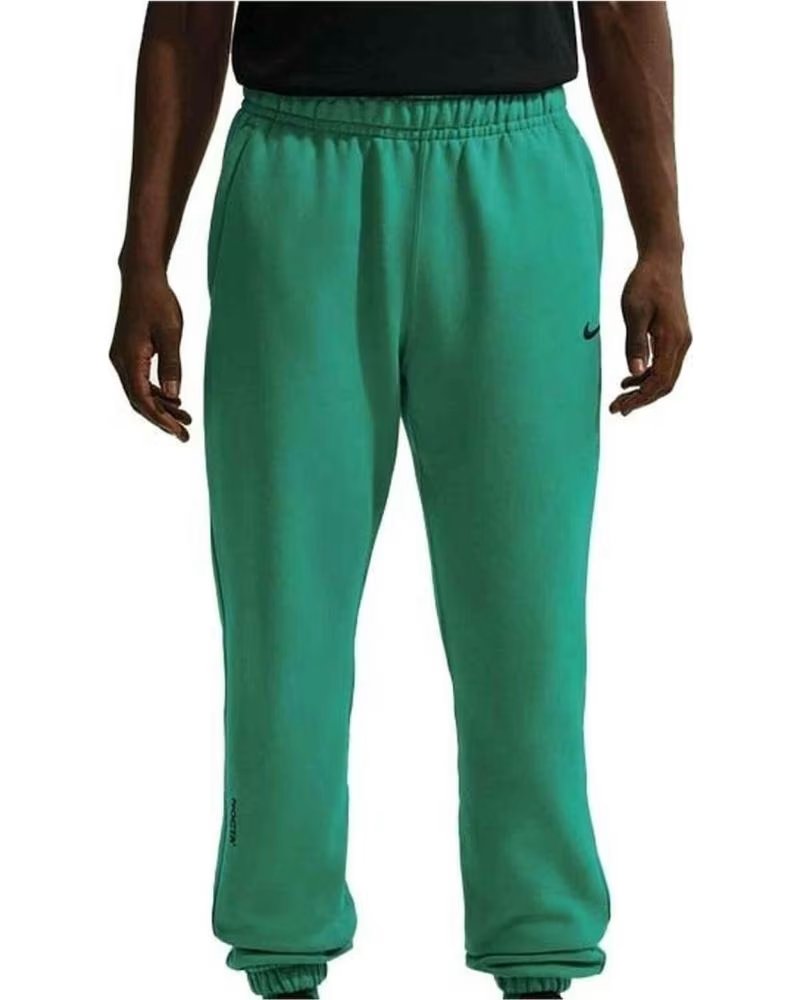 NIKE PANTALON DE CHANDAL X NOCTA FLEECE CS TRACKSUIT BOTTOMS EN VERDE PARA HOMBRE