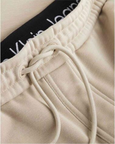 CALVIN KLEIN PANTALÓN JOGGER UNISEX CUT OFF LOGO BEIGE
