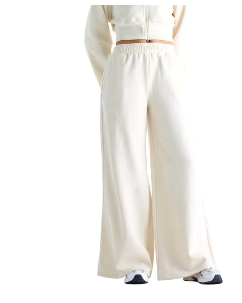 NEW BALANCE PANTALONES BRUSHED COASTAL FLEECE PANT WB6220LW BEIGE
